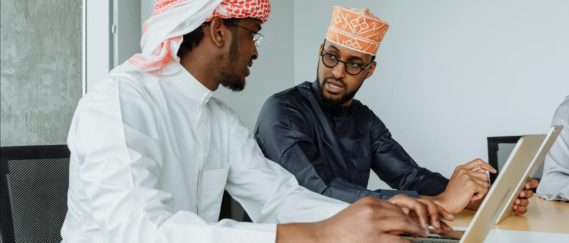 Middle Eastern professionals in project planning meeting